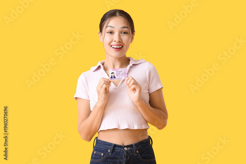 Happy young Asian woman wit...