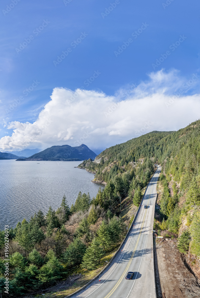 Fototapeta premium Scenic Coastal Highway Along Mountains and Forests on Sea to Sky in Howe Sound, BC, Canada