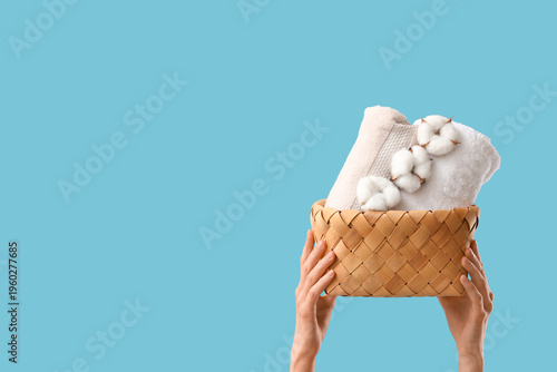 Female hands holding wicker...