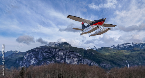 Cuadro en lienzo Seaplane Flying Over Snowcapped BC Mountains With Dramatic Sky and 3D Rendering