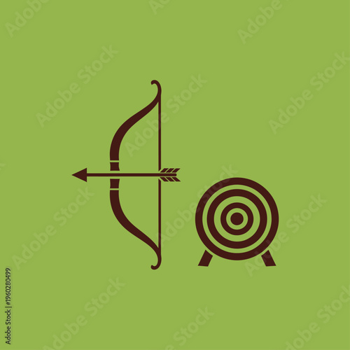 Archery bow arrow and target on green background
