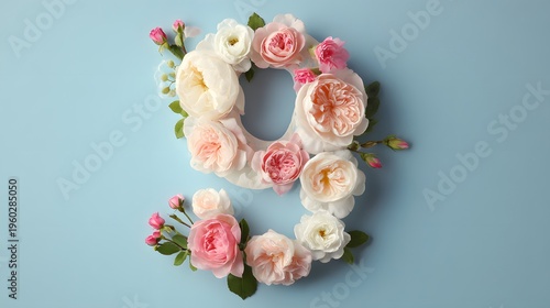 Number Nine Floral Arrangement with Roses and Buds on Blue Background.