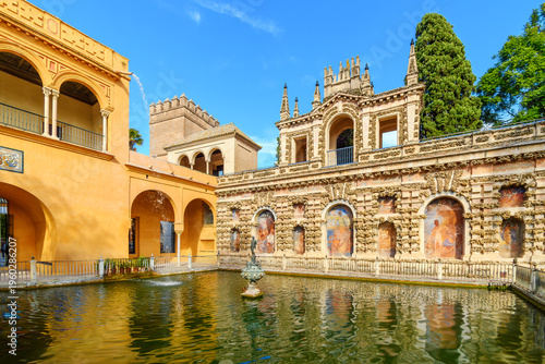 Bild auf Leinwand The Mercury Pond or Estanque de Mercurio with a central statue of the Roman god Mercury within the gardens of the Royal Alcázar of Seville in Spain