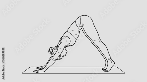 Woman doing downward dog yoga.