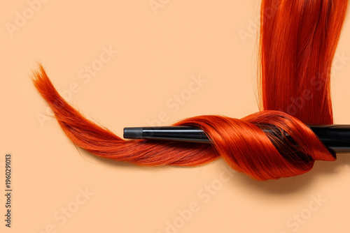 Curling iron with red hair ...