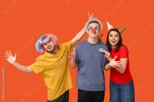 Young friends in funny disg...