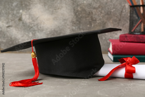 Mortar board with diploma, ...