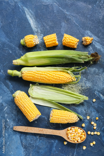 Fresh corn cobs and wooden ...