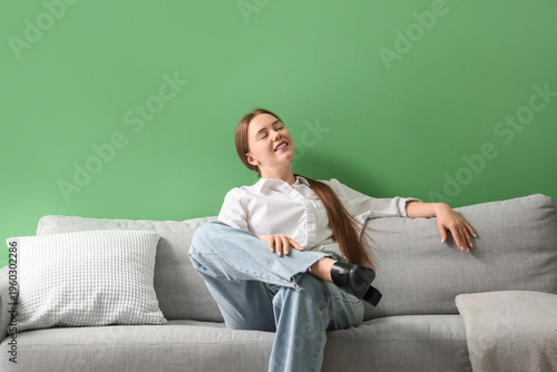 Young woman resting at home after long working day