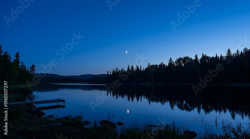 Crescent Moon Reflecting On Calm Forest Lake Water At Night With Wooden Pier In Serene Northern Landscape