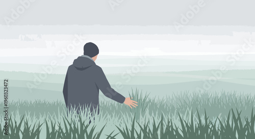 Man Embraces Serene Grassy Landscape With Misty Horizon