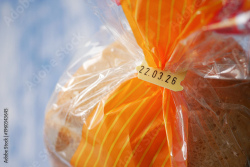 Photos Bread wrapped in clear plastic with an expire date label