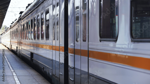 Train parked at a Moscow railway station platform, passenger transport traveling