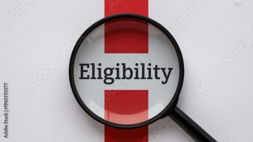 Magnifying glass focuses sharply on the word eligibility placed over the flag of England symbolizing official scrutiny.