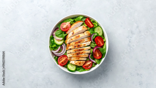 A Delicious Chicken Salad With Vegetables In A White Bowl On A Light Gray Background