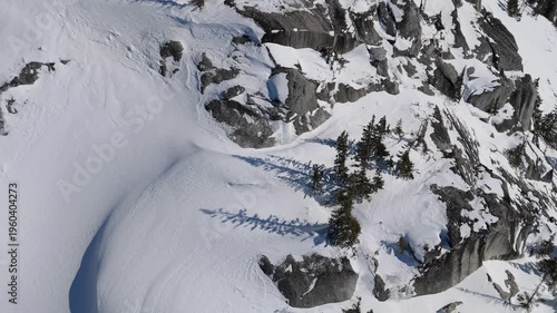 Majestic Aerial View Of Snow-Covered Mountains And Forests In British Columbia, Canada During Winter