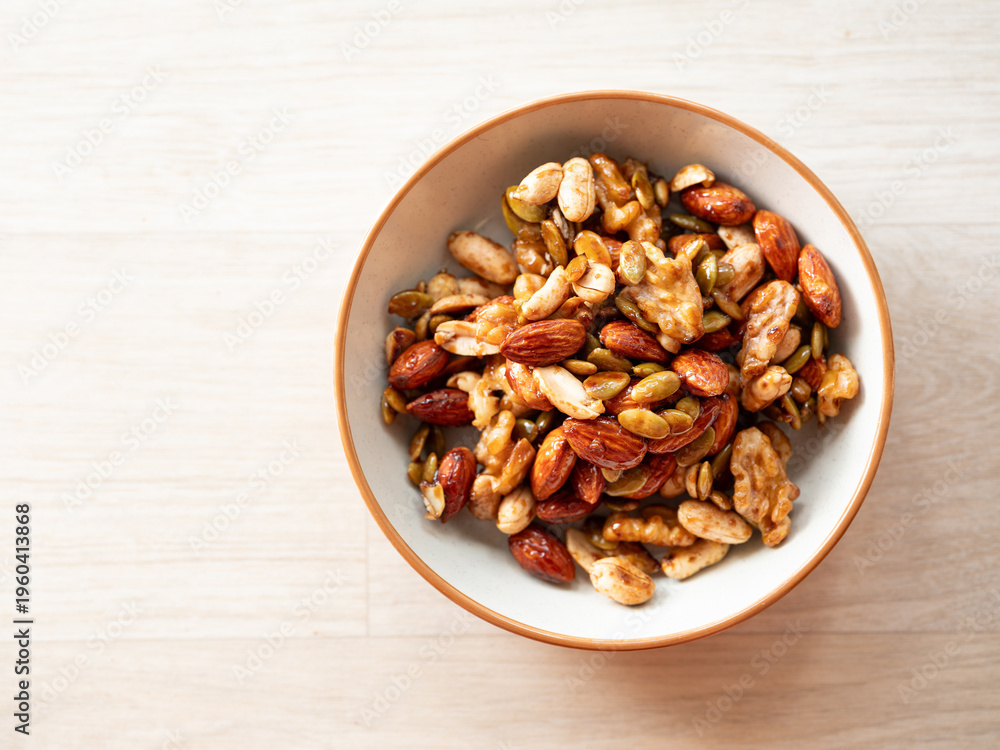 Obraz premium Almonds, walnuts, and nuts on a plate