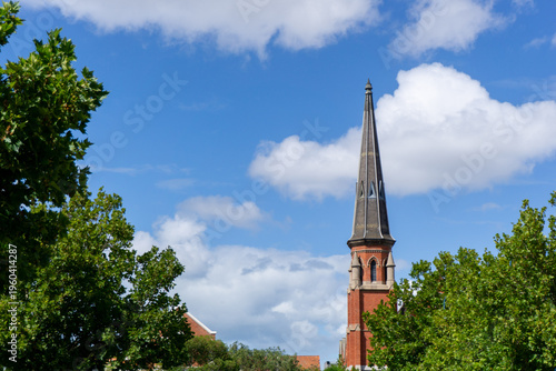 The historic 1891 Methodist Church building, now housing the Dear Abbey Restaurant, featuring Victorian Gothic stone architecture and a prominent spire in moonee ponds Victoria, Australia