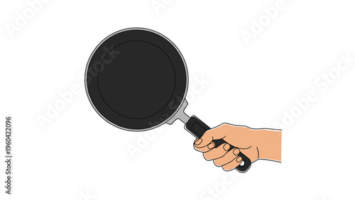 Close up of a human hand firmly gripping the handle of a black non-stick frying pan, isolated on a clean white background for kitchen concepts.