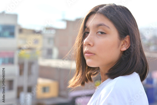 Portrait of calm preteen latin girl.