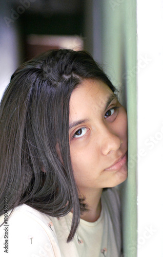 Portrait of calm preteen latin girl.
