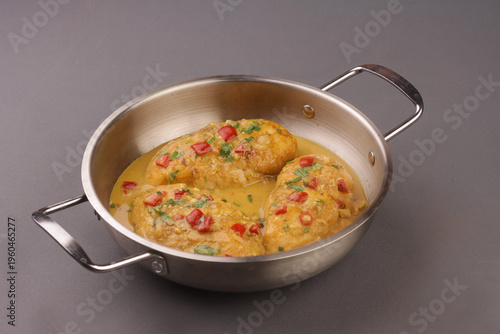 Фотография Brazilian Coconut Chicken or Frango com Leite de Coco is a tender chicken simmered in coconut milk sauce
