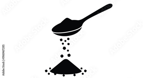 A black silhouette of a spoon pouring granules onto a white background