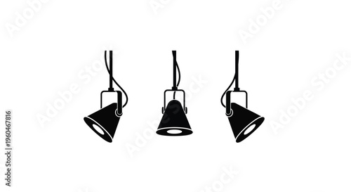 Three black spotlights hang from the ceiling in a minimalist arrangement