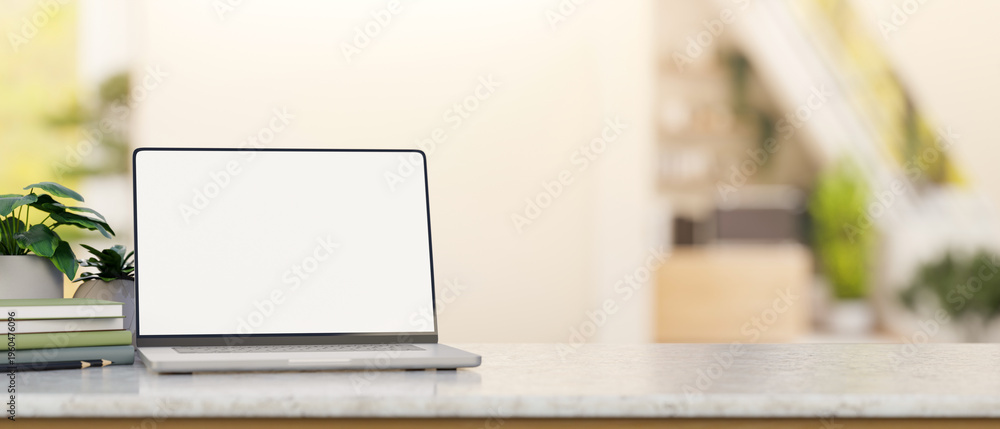 Εκτύπωση καμβά White screen laptop with books and pencil aside potted plants on marble counter