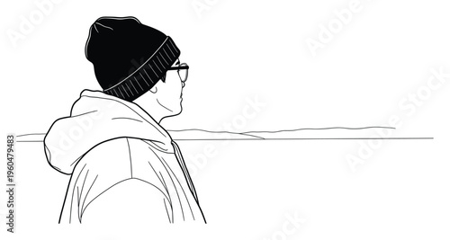 A contemplative person wearing a beanie and glasses looks out at the distant horizon, perfect for depicting themes of observation, future exploration, or quiet reflection in various media