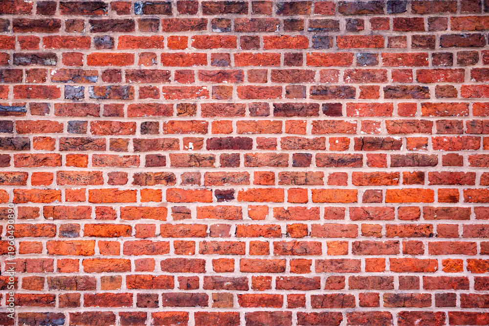 Fototapeta premium Red brick wall surface background. Old bricks masonry wall pattern. Rustic bricks wall texture structure. Grunge bricks classic wall.