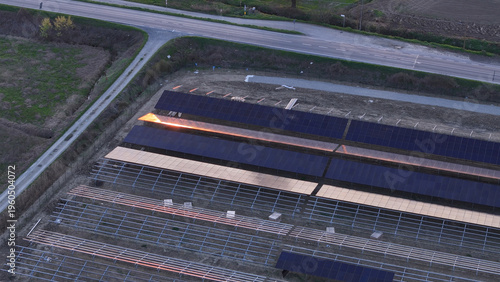 Fotografi Developing a large solar farm in an agricultural field, installing photovoltaic