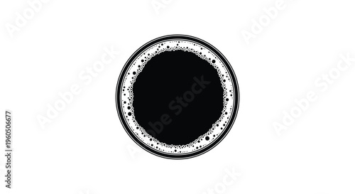 A top down view of a dark coffee drink in a round cup featuring a bold black silhouette