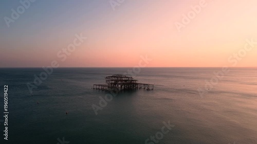 Wallpaper Mural Brighton West Pier Ruins at Twilight Over Calm Sea With Pastel Sunset Sky Aerial drone view Torontodigital.ca