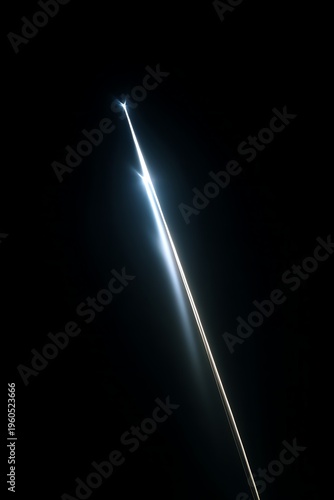 Shooting Star Streak Against Dark Sky