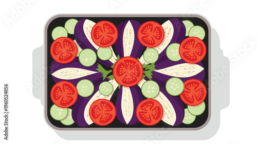 Colorful vegetable ratatouille dish with slices of eggplant, tomato, and zucchini arranged in a baking pan against a white background.