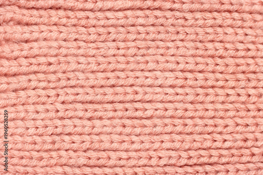 Fototapeta premium Pink knitted sweater fabric pattern background
