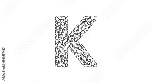 Stylized monochrome initial K composed entirely of diverse legumes, illustrating a unique