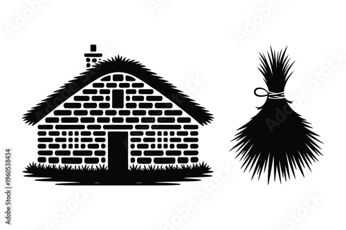 Thatched roof cottage and bundle of reeds with black and white