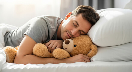 Young man sleeping peacefully in cozy bed holding fluffy teddy bear perfect for comfortable home lifestyle and deep relaxing rest