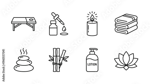 Relaxing spa essentials: massage table, oils, candles, towels, stones, bamboo, lotion, flowers.