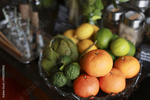 Tableau sur toile Vibrant fresh citrus fruit arrangement featuring orange, lemon, lime, and kaffir