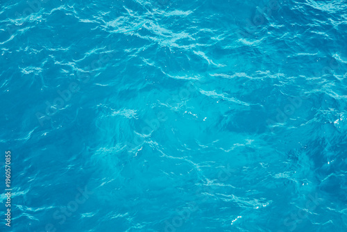 Blue ocean water displays texture and movement in natural form