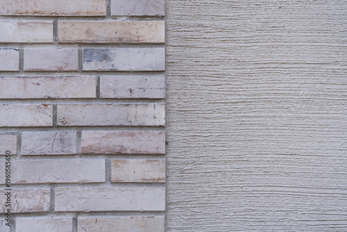 brick wall background, Beautiful Wall with a part of bricks and at the other part of concrete rough surface, space for text