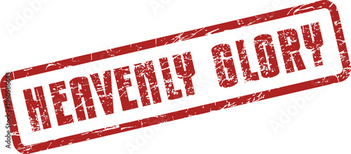 A weathered red rubber stamp prominently displays the inspiring message Heavenly Glory on a clean surface