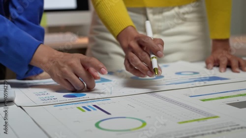 Businesswomen analyzing data and charts during office meeting