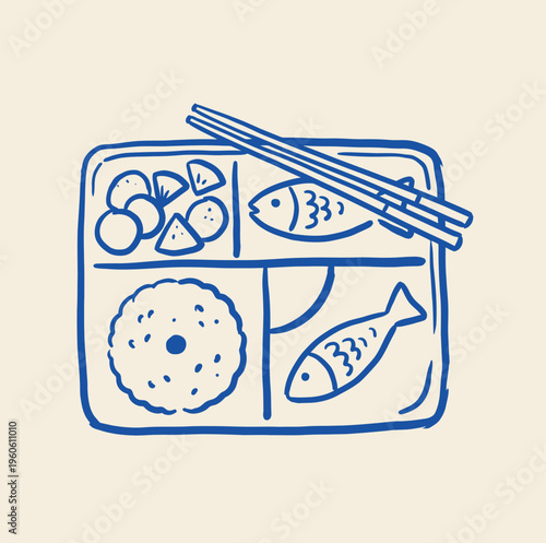 A Japanese style bento box is shown divided into compartments containing rice, two stylized fish, and small vegetable portions with chopsticks resting on top.