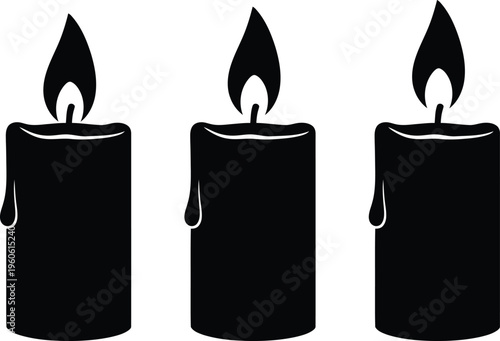 Three black candles with flames