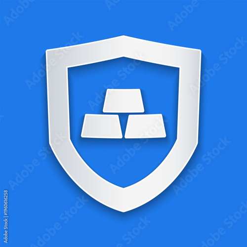 Paper cut Gold bars with shield icon isolated on blue background. Banking business concept. Paper art style. Vector