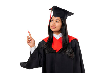 Graduate points finger while wearing graduation cap, isolated, PNG